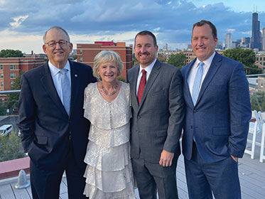 Debbie and Doug Dibbert with their sons, Michael ’99 and Brian ’01