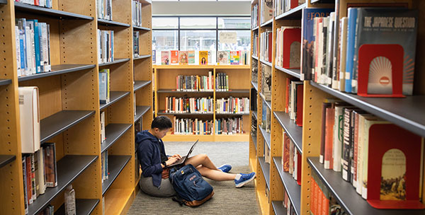 A student reading in a library