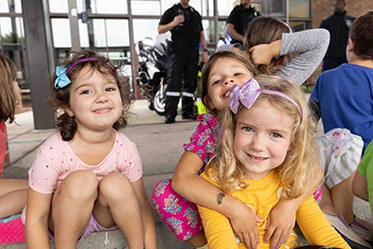 Three girls being silly together. Links to Gifts of Life Insurance