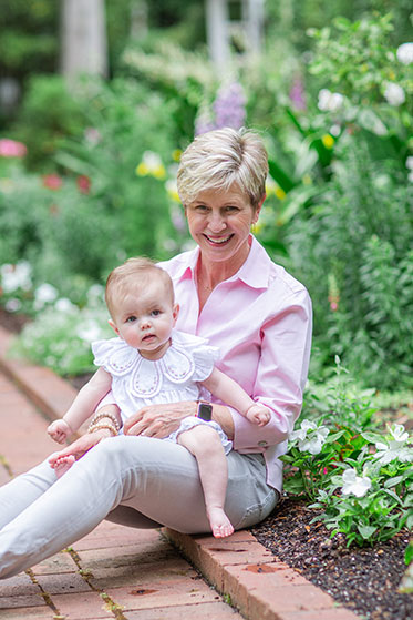 Emily Oliver holding a baby in her lap